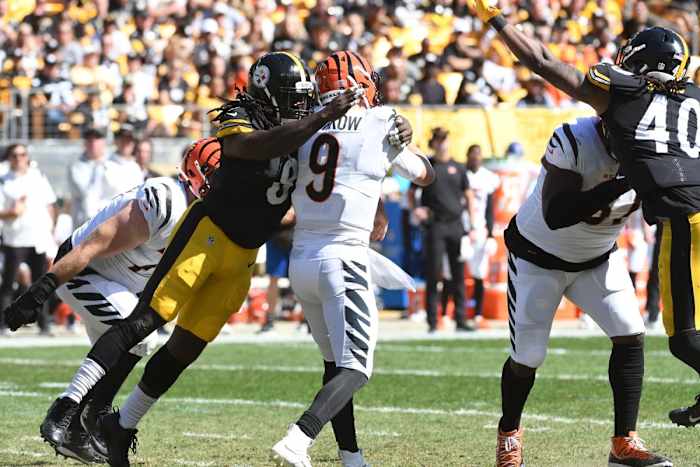 Sep 26, 2021; Pittsburgh, Pennsylvania, USA; Pittsburgh Steelers linebacker is flagged for a late hit on Cincinnati Bengals quarterback Joe Burrow during the second quarter at Heinz Field. Mandatory Credit: Philip G. Pavely-USA TODAY Sports